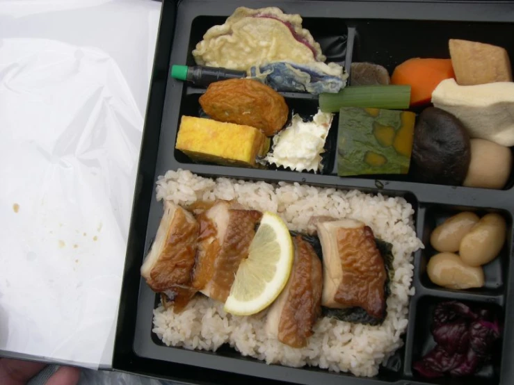 an open case of food containing some kind of fish