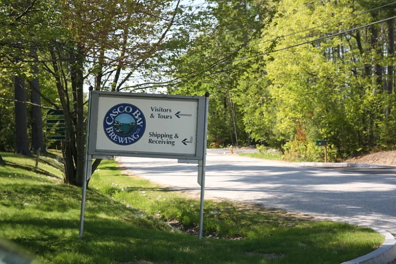 a small sign on the side of the road