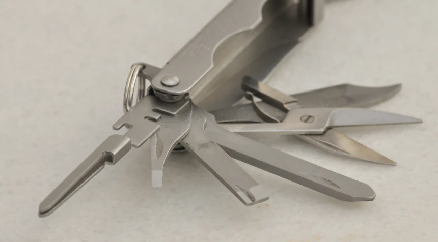 multiple multi - tool multi cutters attached to a hook