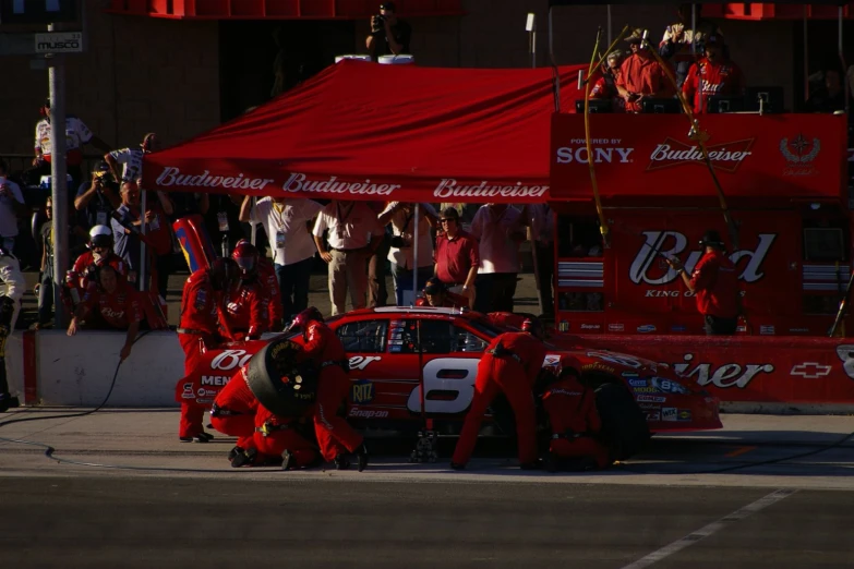 a red car sitting on top of a race track