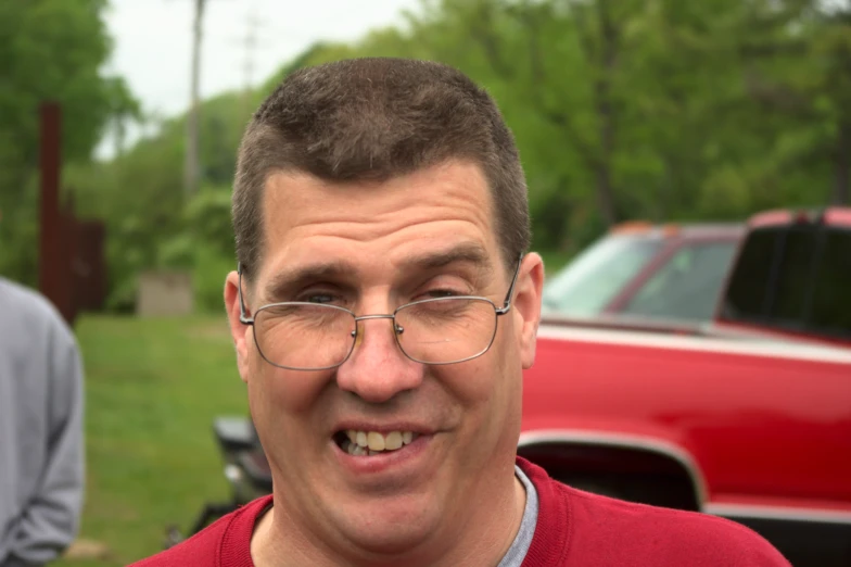 a man wearing glasses looking at the camera