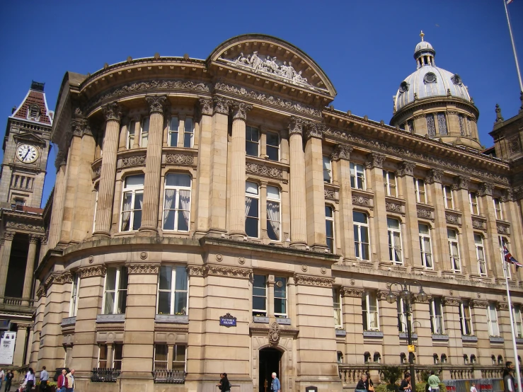 an old building with clocks on the roof