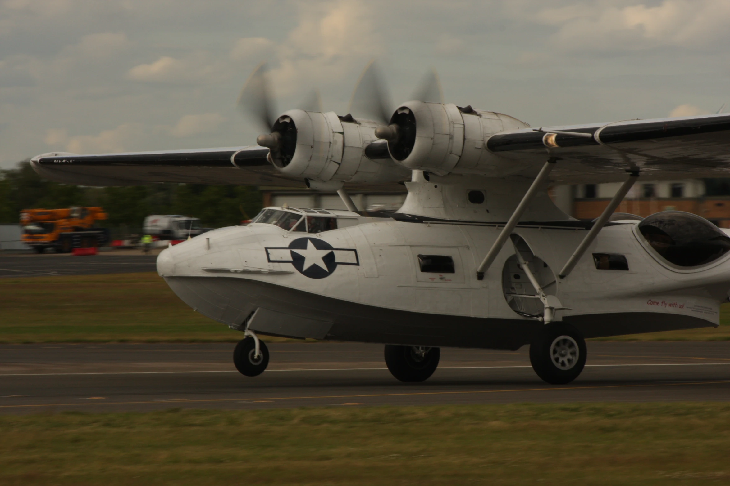 a propeller airplane sitting on a run way