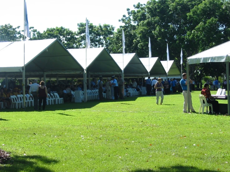 some men standing in a field watching others