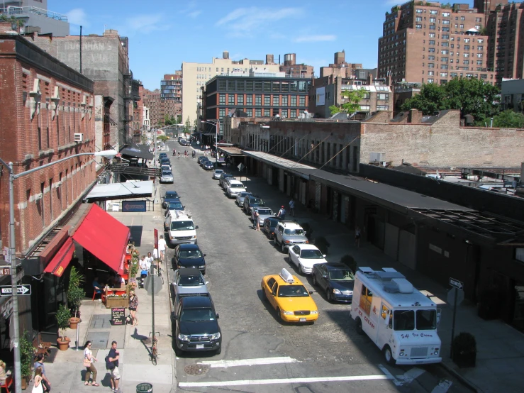 a city street with cars parked on both sides
