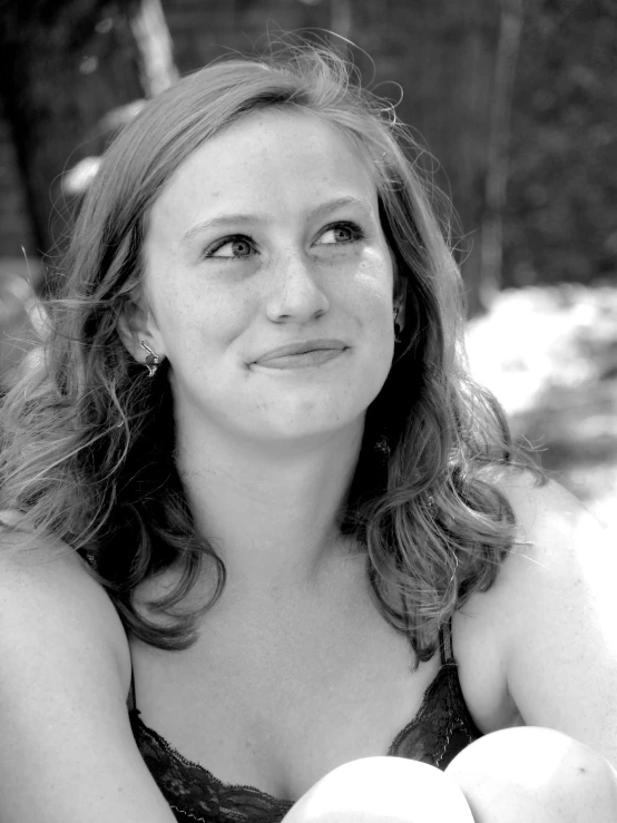 a young woman in black  top looking at the camera