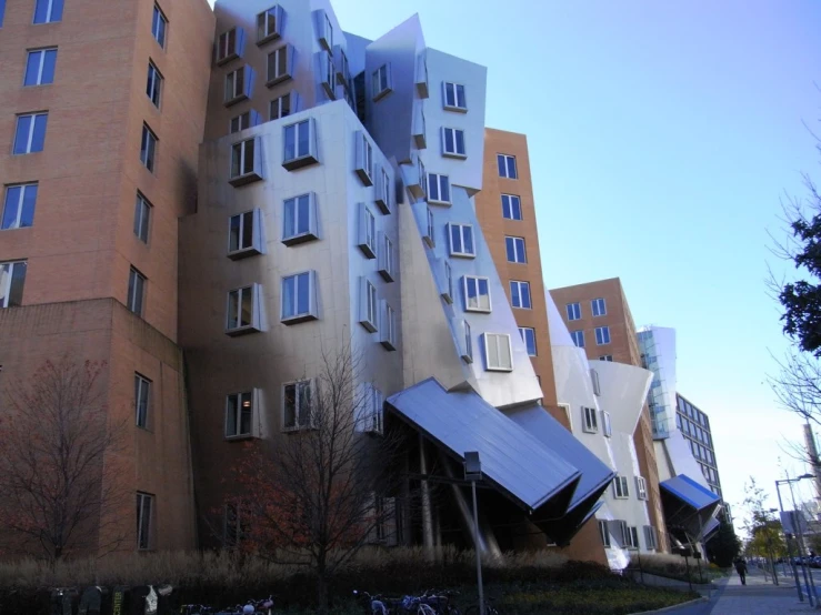 an exterior view of buildings with a bicycle parked outside