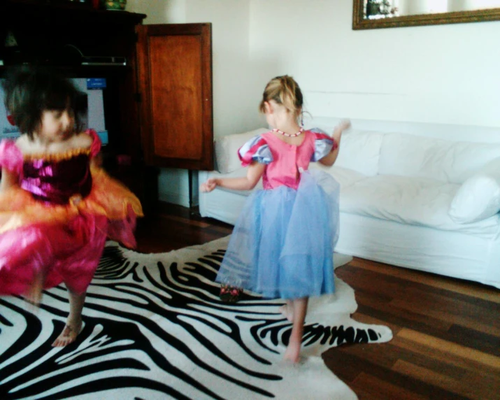 two children dressed up in costume on the floor