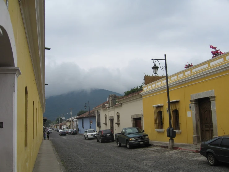 cars are parked on the side of a street