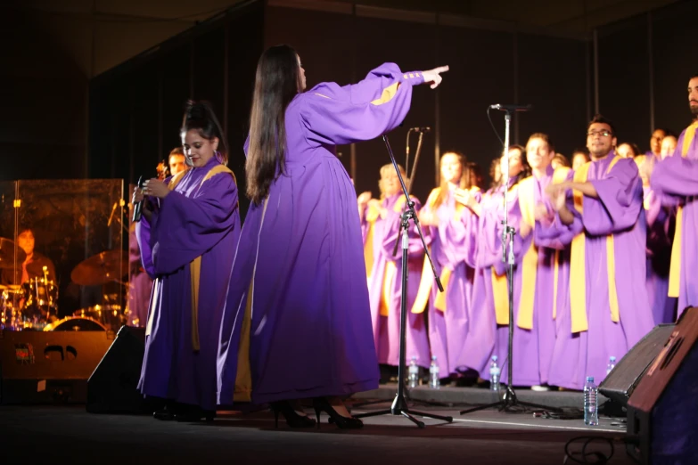 a woman in a purple robe in front of choir