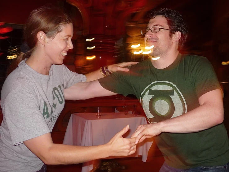 a man and a woman are doing soing in a dance pose