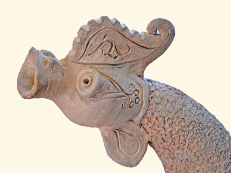 a ceramic fish made from clay that is not being used in art