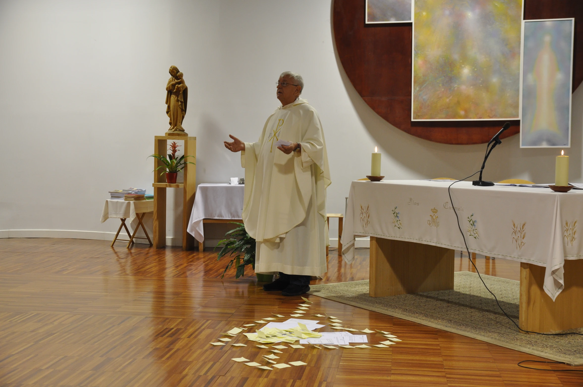 the priest is standing in the empty room