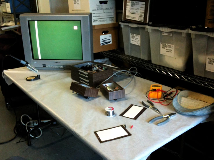 a small desk with a computer on top of it