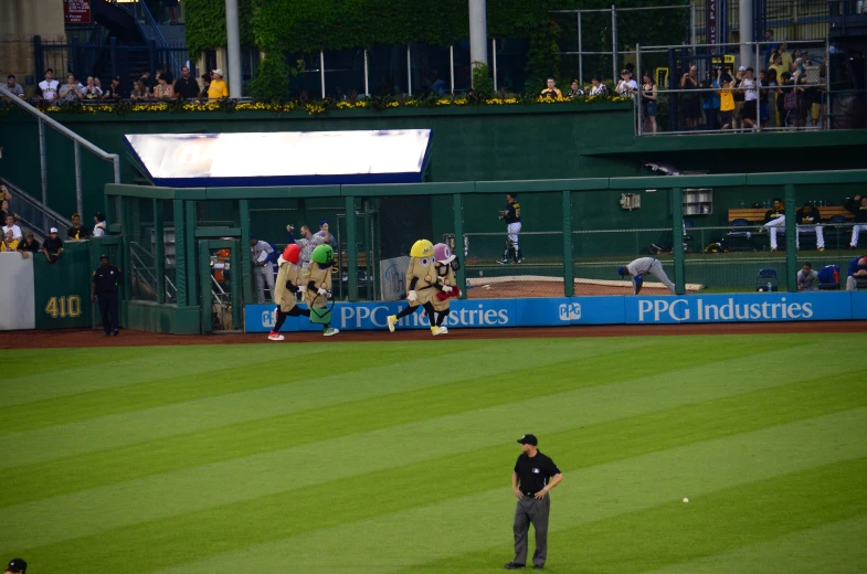 some baseball players and people at a game