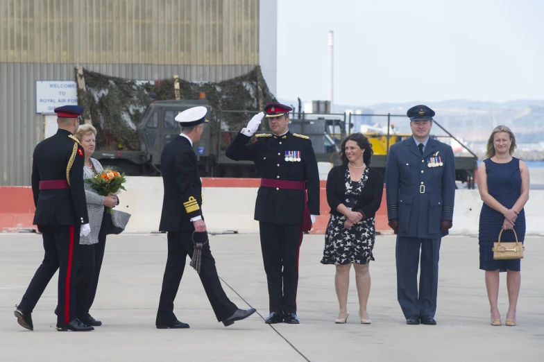 an air force officer is presented to military officials