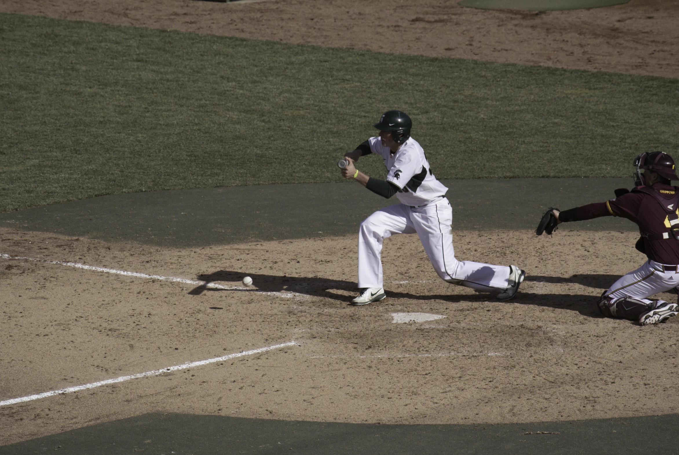 a baseball player trying to steal a ball