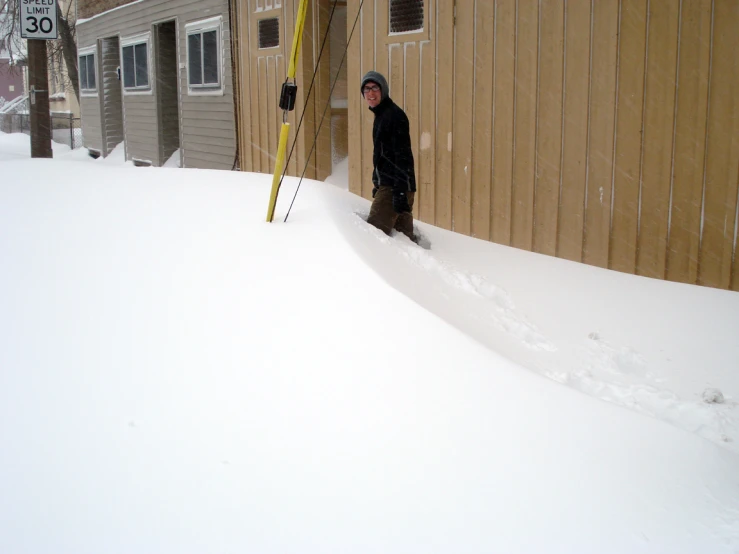 there is a person standing in a pile of snow