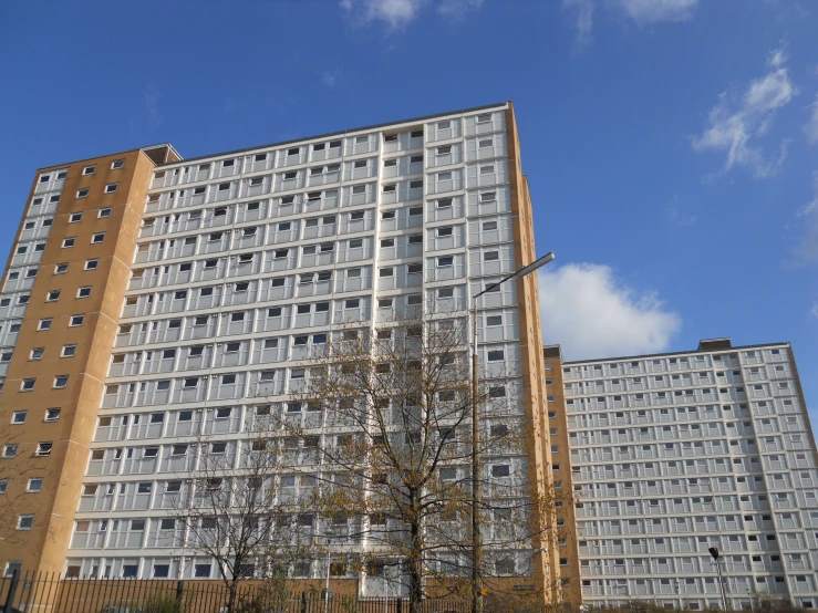 two large brown buildings are next to one another