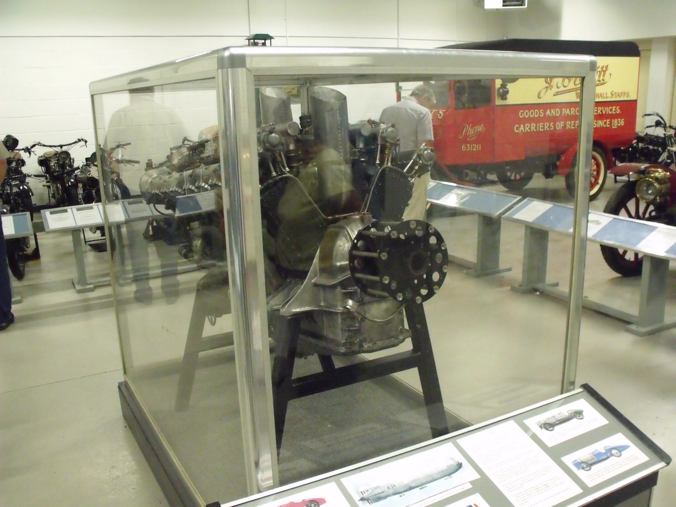 an old fashioned airplane engine on display at a museum