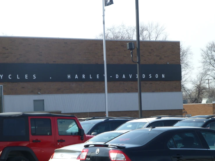 cars are parked in front of a building