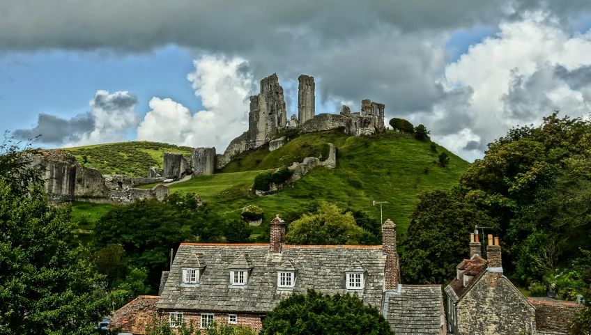 an image of a castle like setting in the mountains