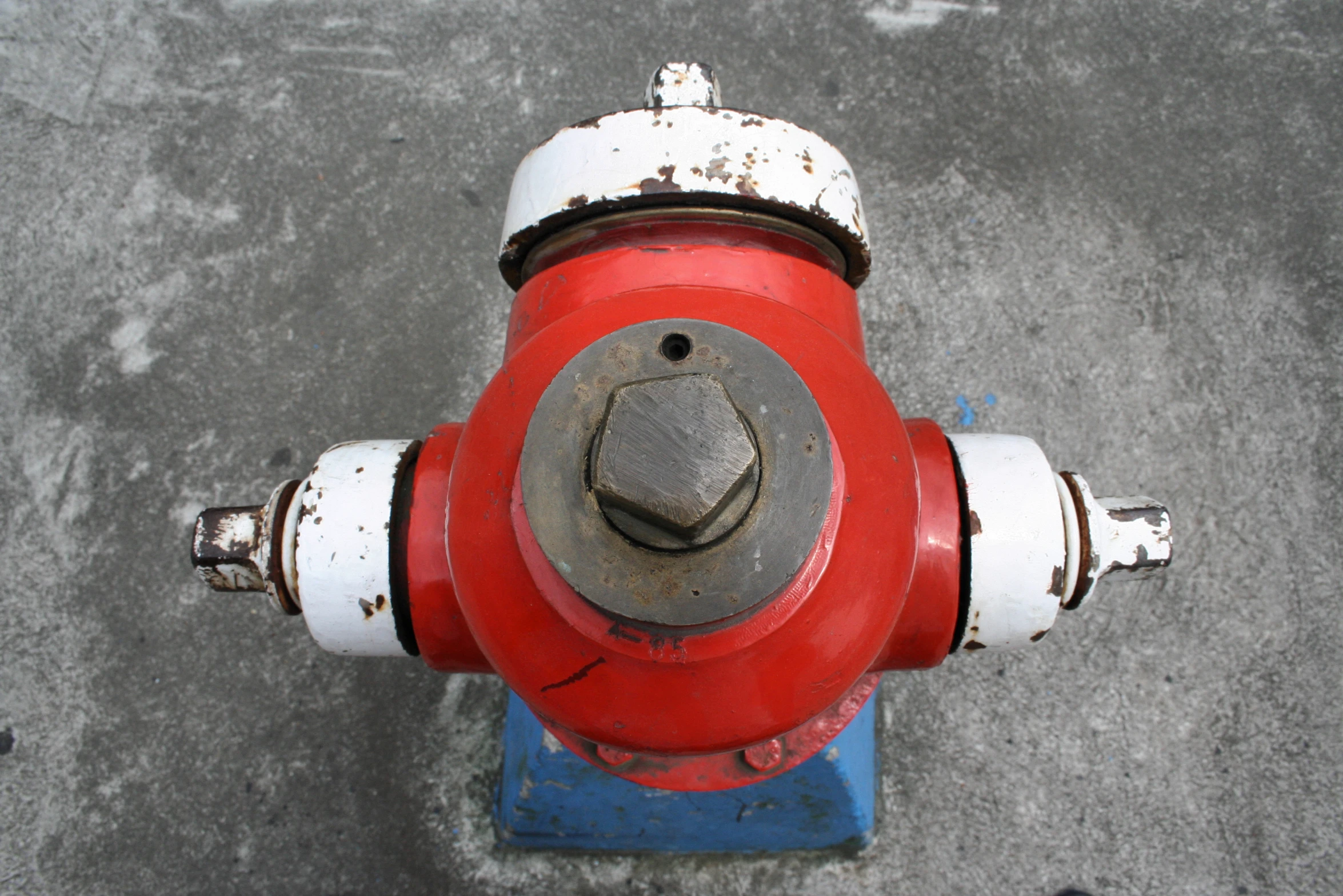 an aerial view of an old red and white fire hydrant