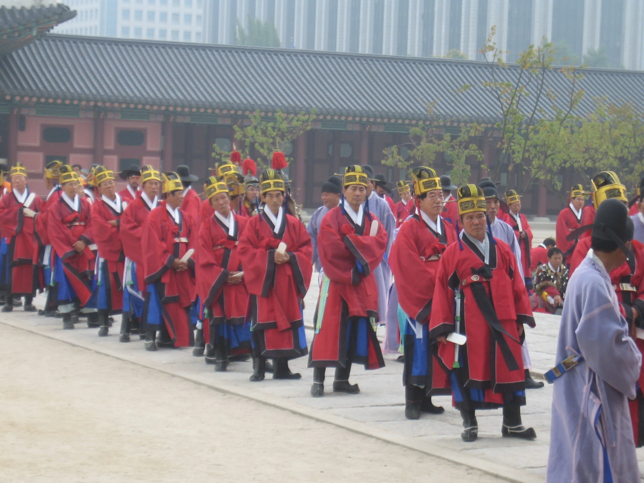 the performers are wearing red and black outfits