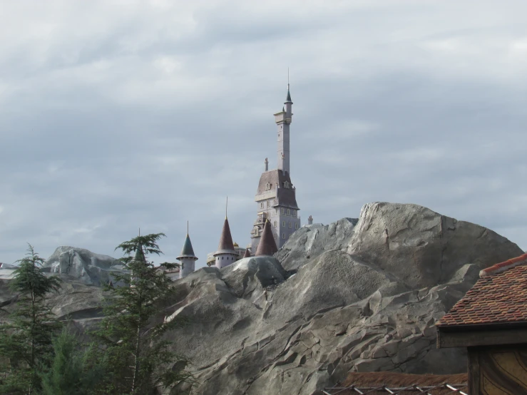 an old style castle is sitting on top of a hill