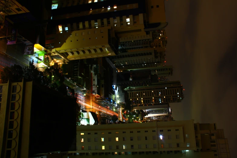 a city at night with a traffic light on it