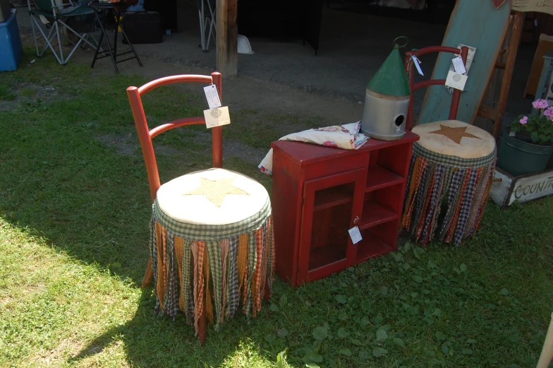 a chair with a table and some small wooden stools