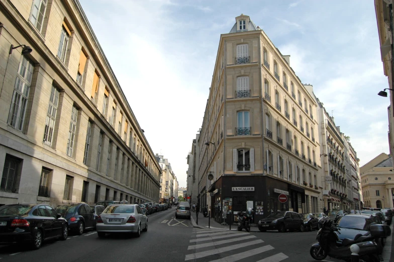 this is a very tall building next to a cross walk