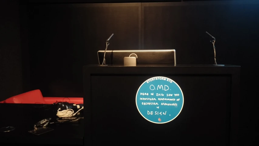 a dark room has an illuminated podium