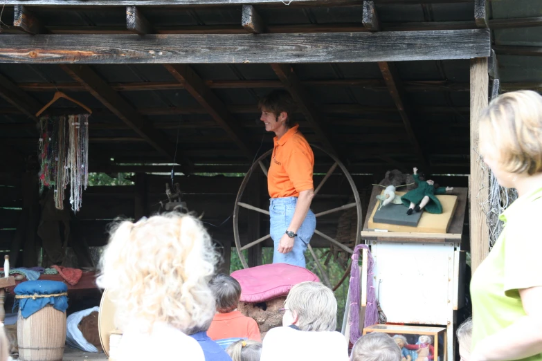 a man standing in an outdoor space with lots of people