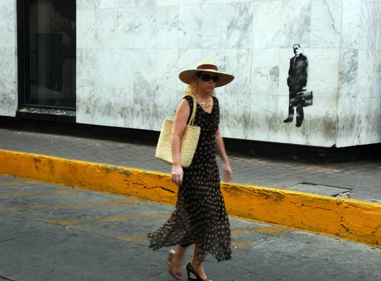 a lady walking down a city street