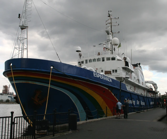 a large blue and red boat in a body of water