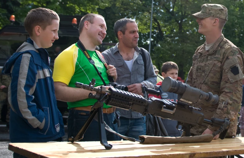 a group of people with guns and a soldier