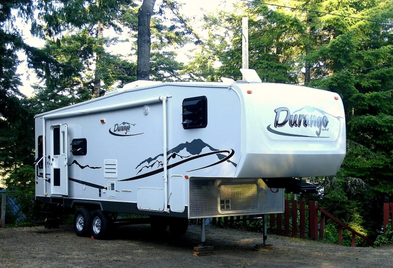 this is an rv parked in a yard