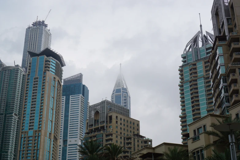 the blue skyscrs are under construction in the city