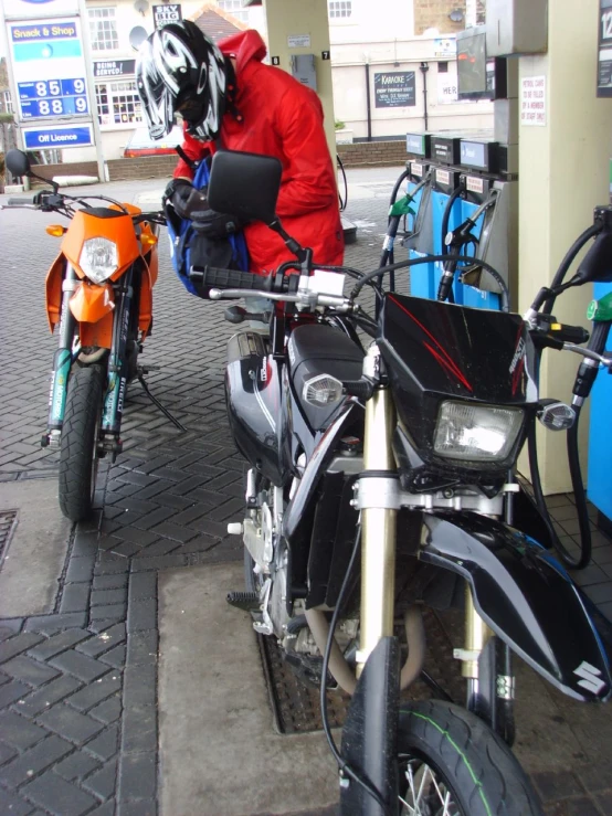 a person in a red jacket on a motorcycle