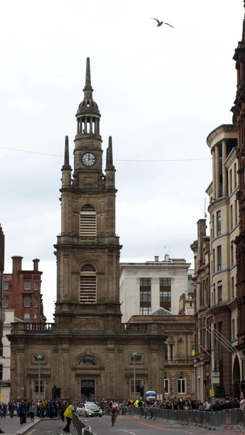 large buildings in the city with people walking by