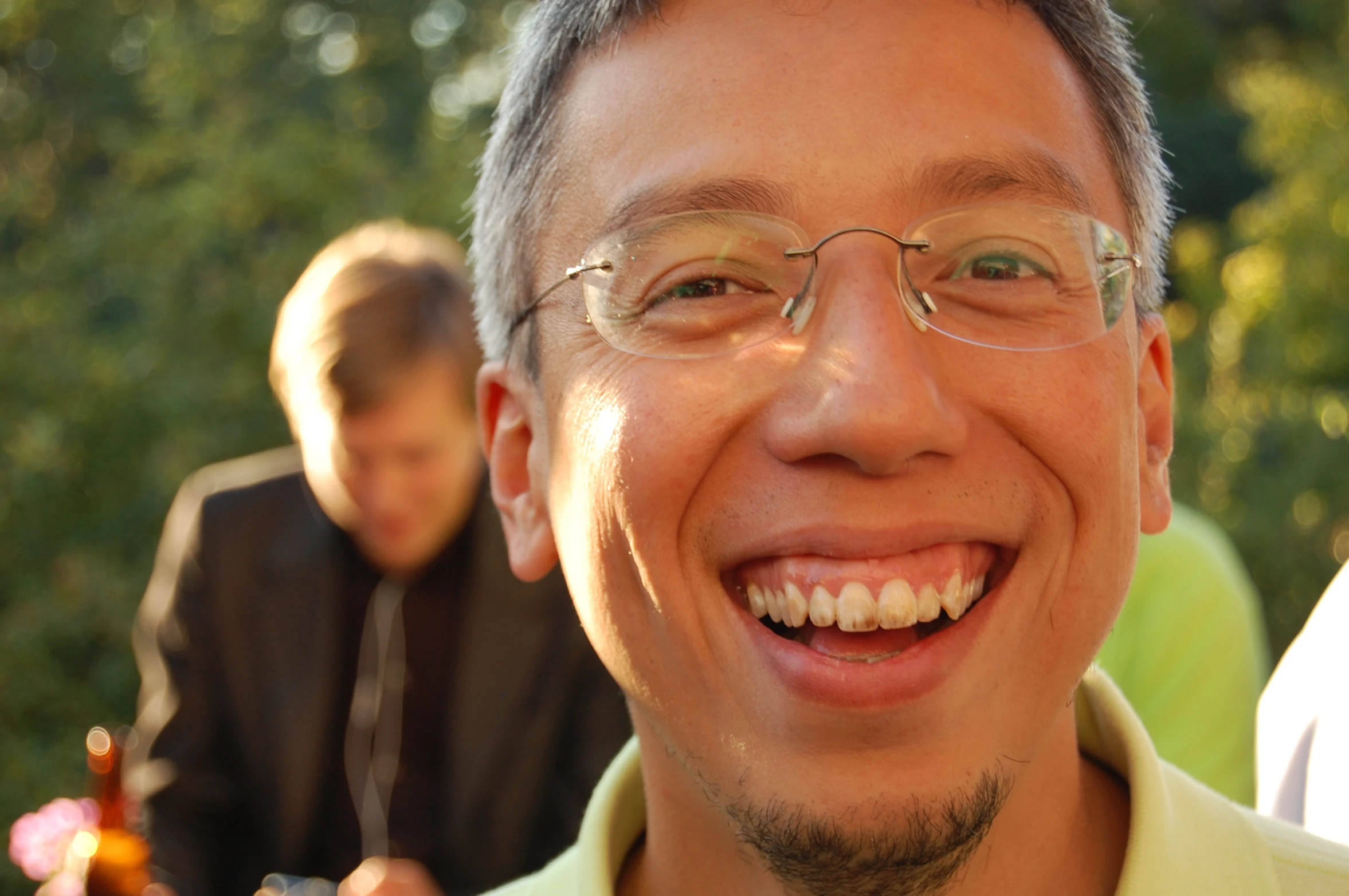 a close up of a person smiling at the camera