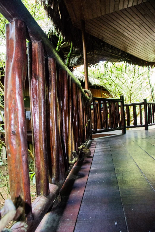 an outdoor area is lined with many wooden fencing