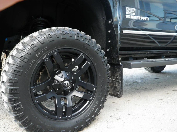 the tires and wheel hubs of the pick up truck