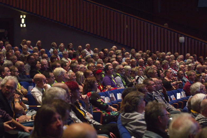 the crowd is listening intently to the speakers