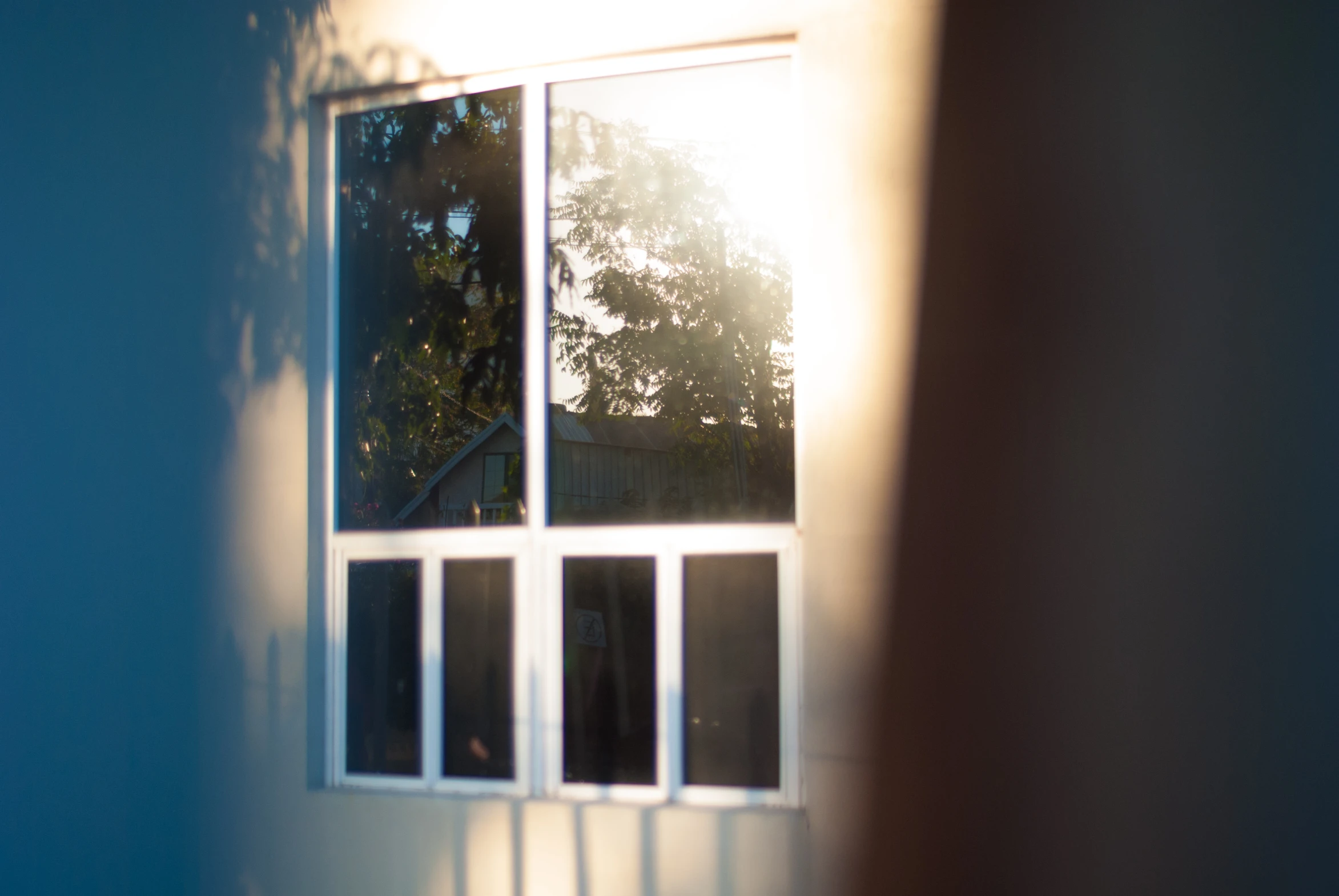 the sun shines through the window onto a residential area