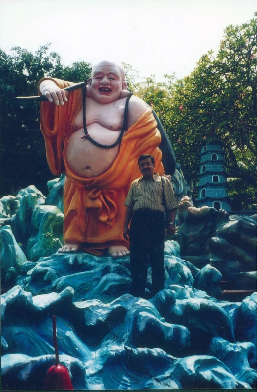 an image of a large statue in the air with a man next to it