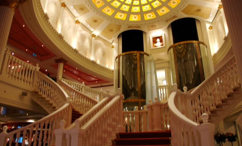 the inside of a building with stairs and lights