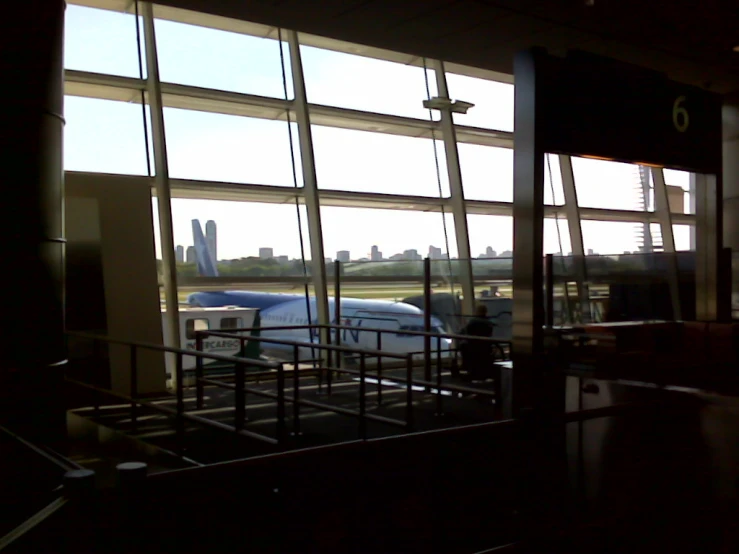 an airplane outside the window in a building