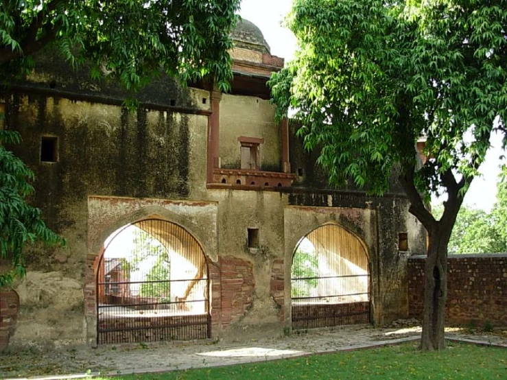 an old building with a fenced off courtyard